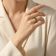 Asian woman wearing emerald green stone ring - 1024x1024