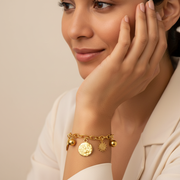 Latina woman wearing gold charm bracelet - 1024x1024